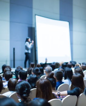 Marketing executive recruiting doing a speech