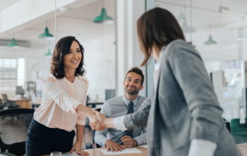 Business woman shaking hands